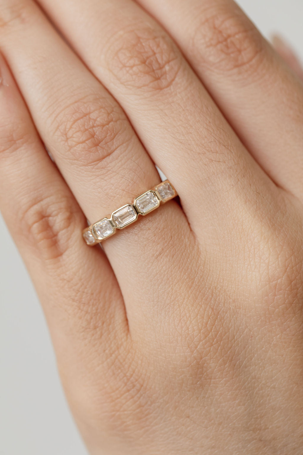 Bezel set emerald cut diamond statement ring