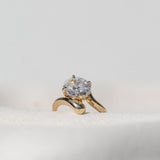 Floating Oval Solitaire cross band Ring