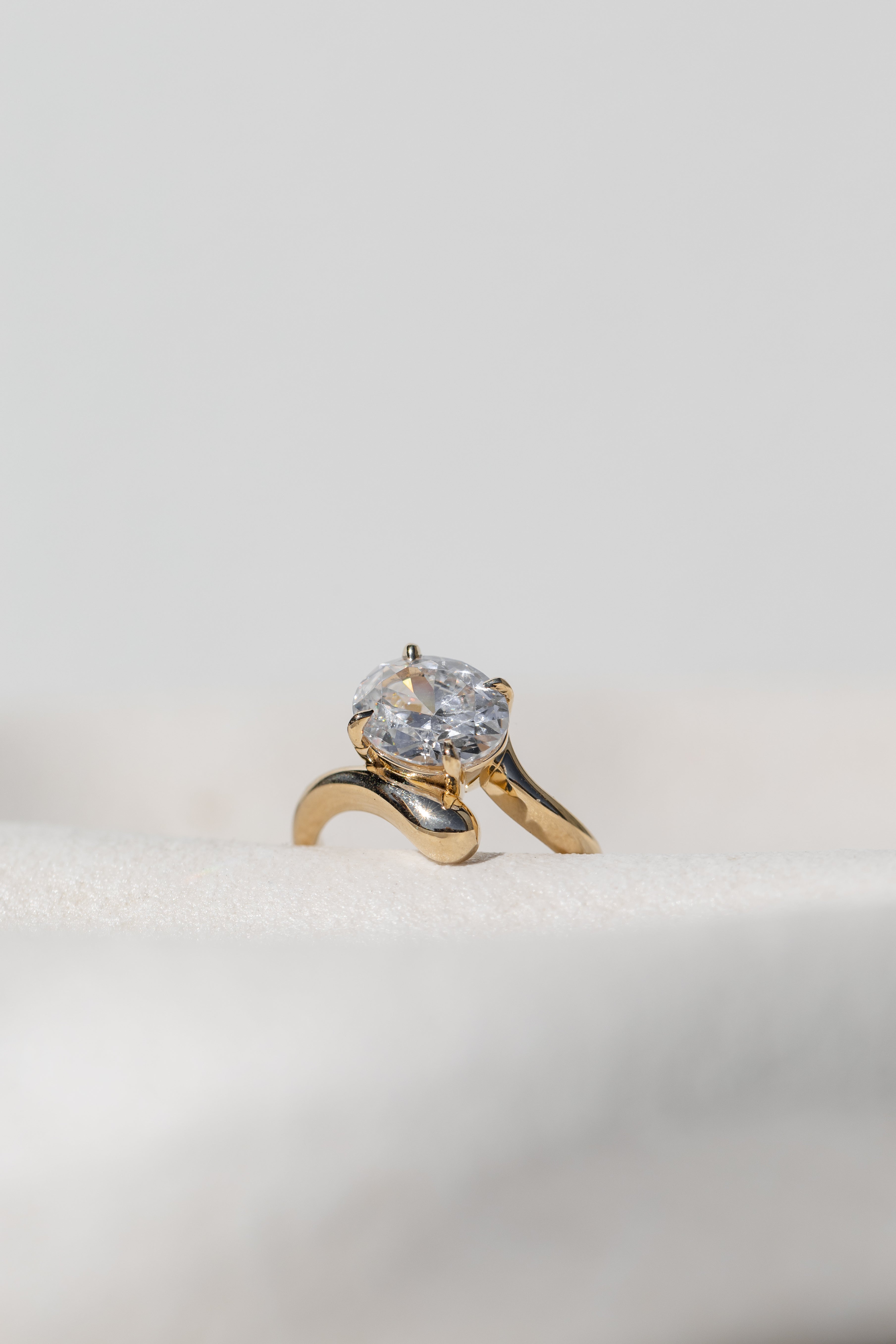 Floating Oval Solitaire cross band Ring