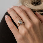 gold curved wedding ring and low set engagement ring