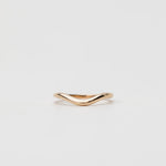 Gold curved wedding ring