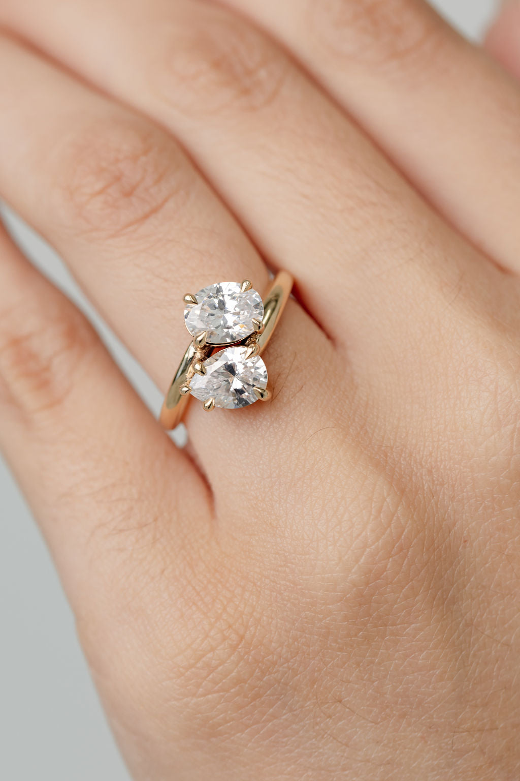 Toi et Moi diamond engagement ring with  a pear cut diamond and an oval cut diamond