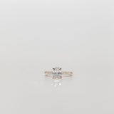 Oval diamond engagement ring with pave diamonds in the band