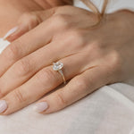 Oval cut diamond engagement ring with side stones