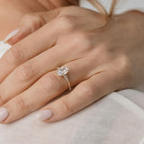 Oval cut diamond engagement ring with side stones
