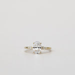 oval engagement ring with diamonds on the band
