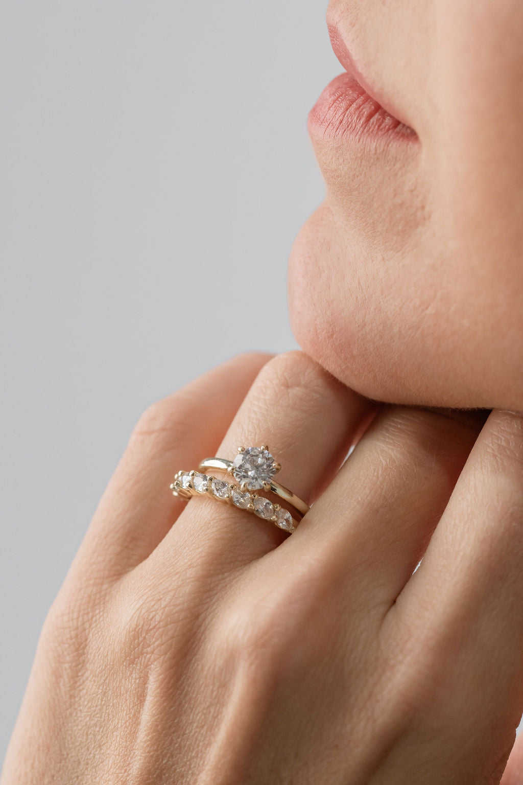 Round Brilliant Cut Solitaire engagement ring with marquise cut diamond wedding ring