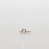 Three stone diamond engagement ring with marquise centre stone and half moon cut diamond side stones
