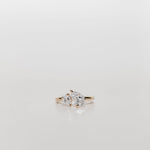 Toi et Moi Diamond engagement ring with one large pear cut diamond and one small pear cut diamond