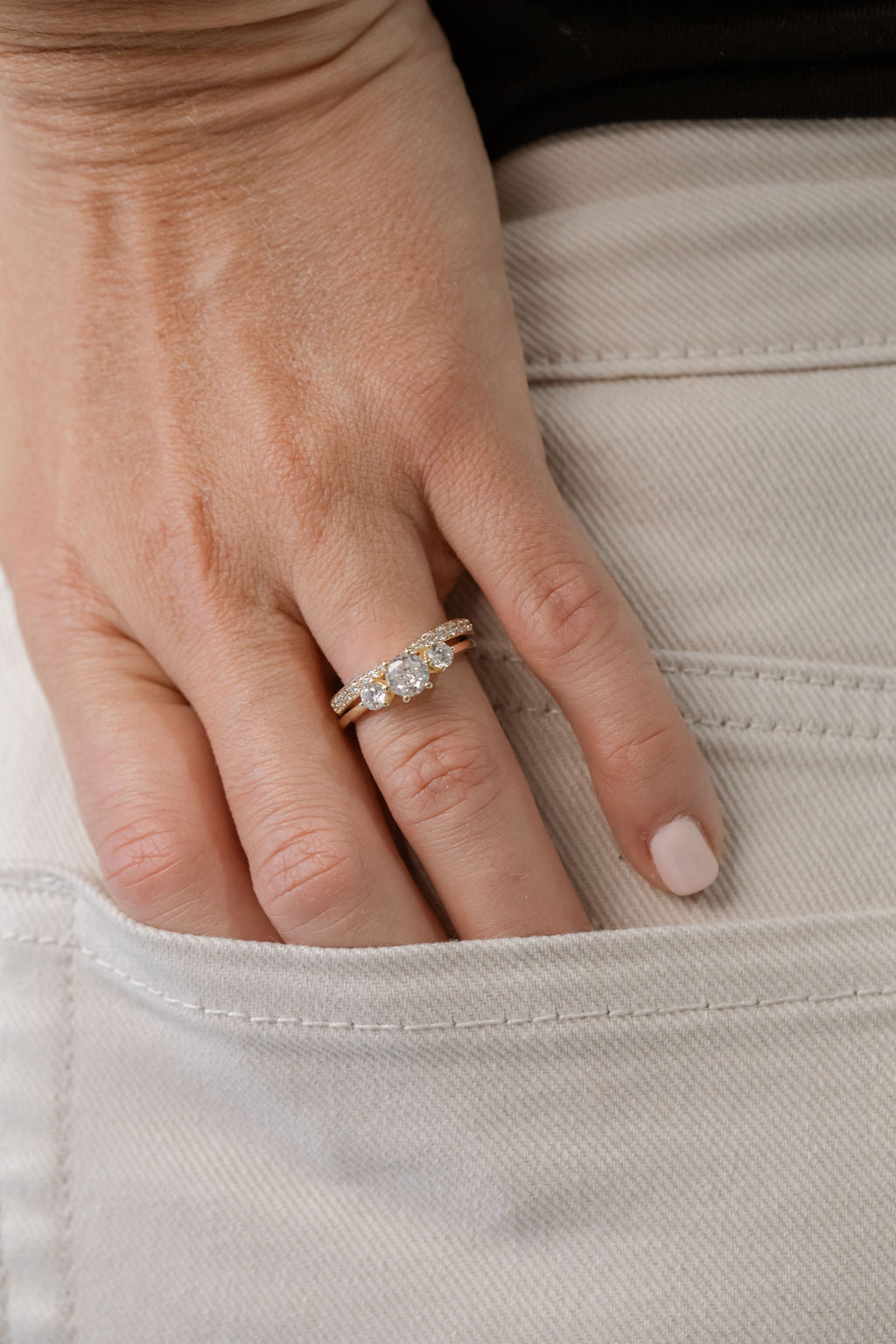 trilogy three stone engagement ring with tapered diamond wedding ring