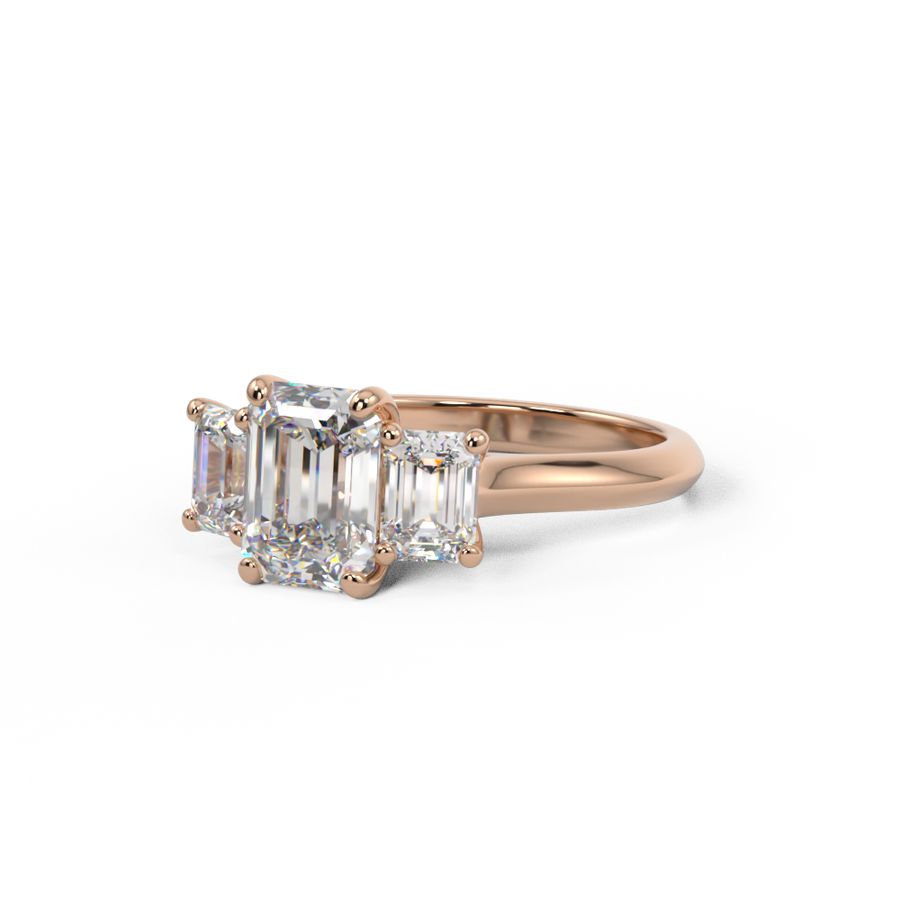 Trilogy three stone ring with three emerald cut diamonds