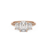 Trilogy three stone ring with three emerald cut diamonds in rose gold