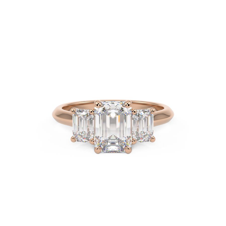 Trilogy three stone ring with three emerald cut diamonds in rose gold