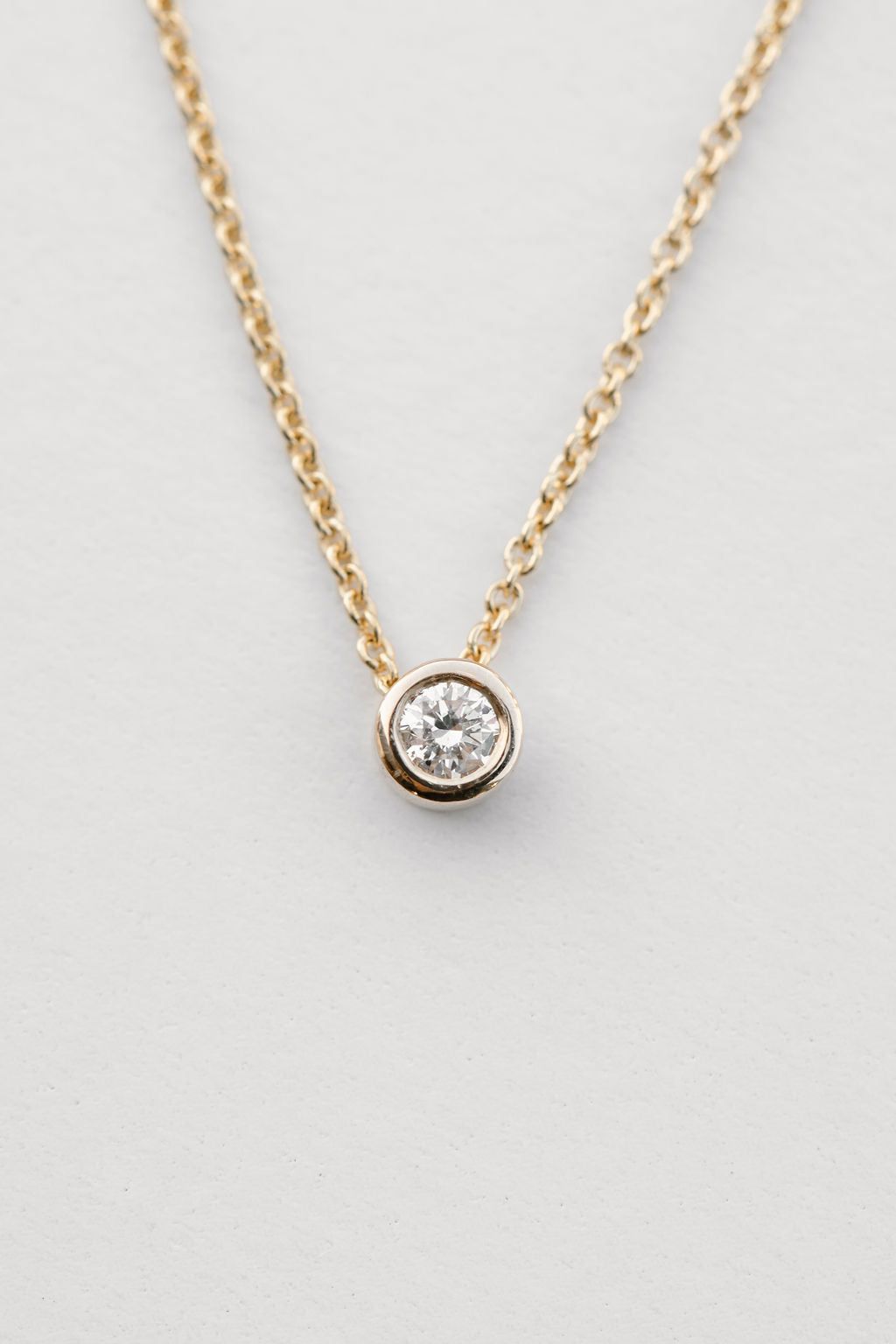 diamond bezel set necklace in 18kt gold