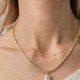diamond dotted necklace with rope necklace and oval locket