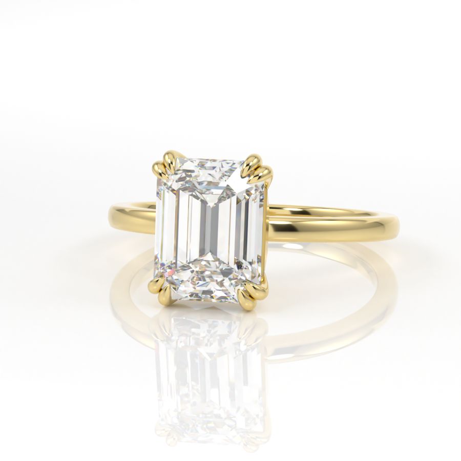 Double claw solitaire engagement ring with emerald cut diamond centre