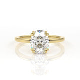 Double claw oval solitaire engagement ring in yellow gold