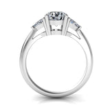 white gold 3 stone diamond engagement ring with a round centre stone and trilliant triangle shape side stones