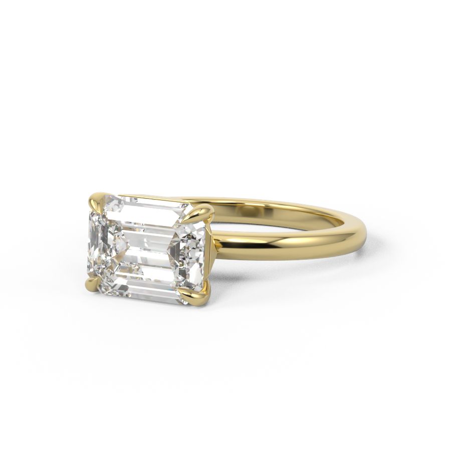 Emerald cut diamond engagement ring set at east west