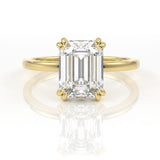 Emerald cut moissanite double claw engagement ring