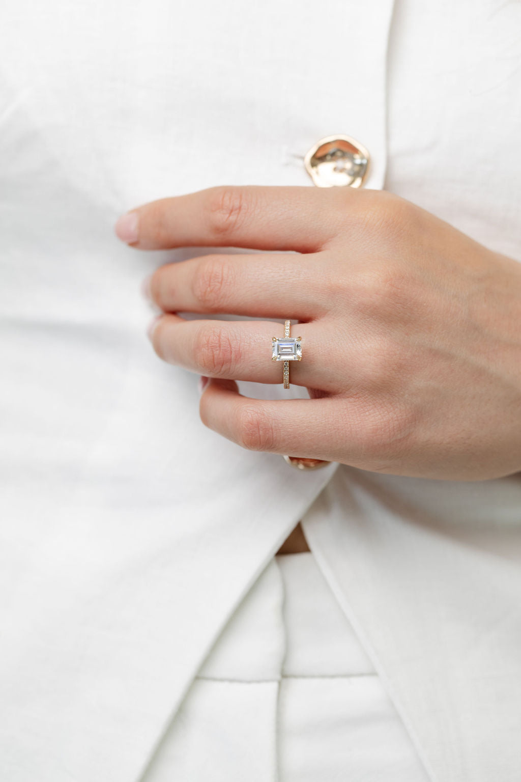 emerald cut diamond engagement ring with diamond band