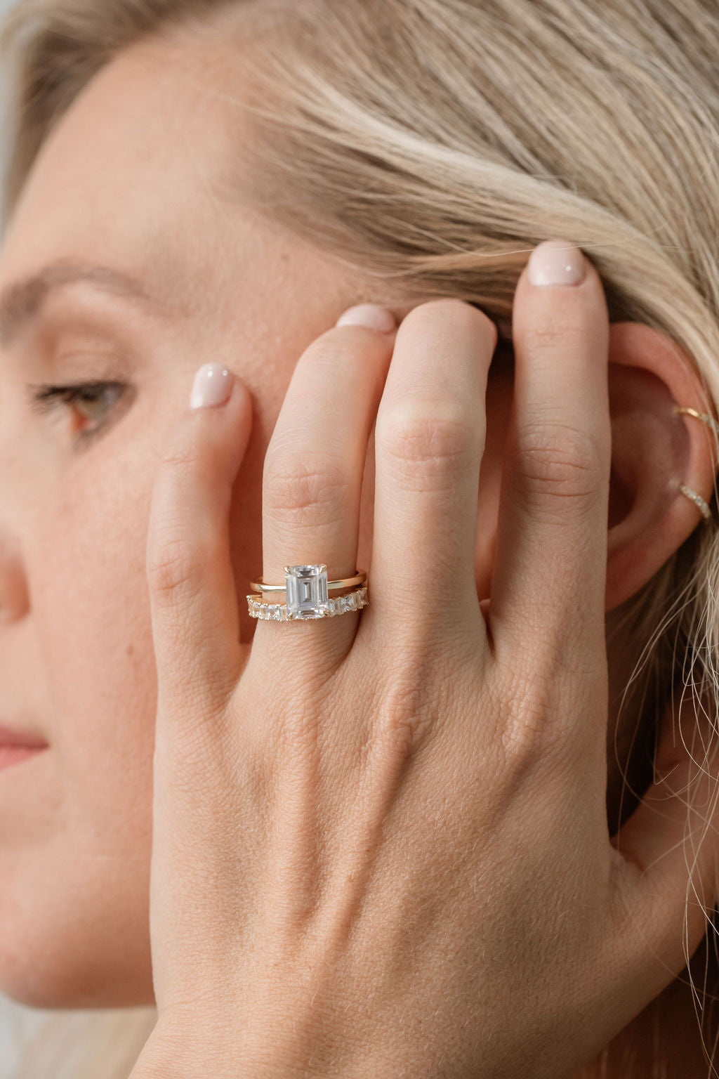 emerald cut solitaire engagement ring with statement diamond ring featuring princess cut and baguette cut diamonds