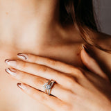 Eternal - claw set diamonds with a sweeping scallop setting