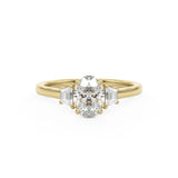 Oval Trilogy Three stone ring with trapezoid side stones