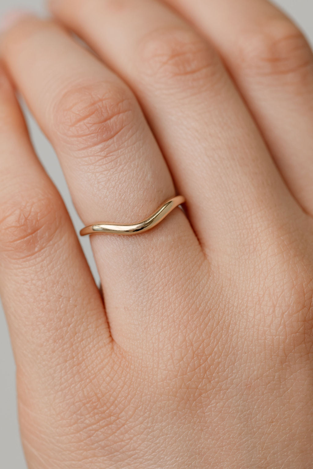 gold curved wedding ring