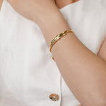 Gold crossover bangle