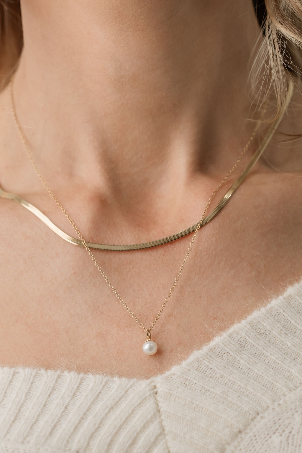 gold herringbone necklace and pearl pendant necklace