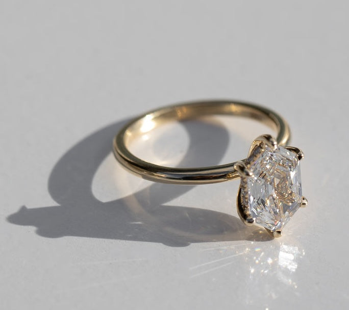 hexagonal cut diamond solitaire engagement ring