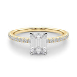 yellow gold emerald cut moissanite on a fine moissanite band