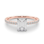 rose gold emerald cut moissanite on a fine moissanite band