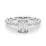 white gold emerald cut moissanite on a fine moissanite band