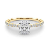 yellow gold oval shape moissanite engagement ring with fine moissanite band