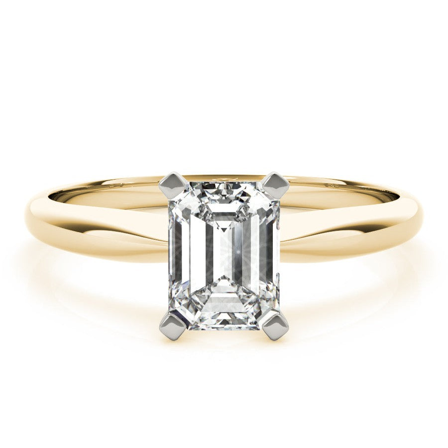 Yellow gold tapered engagement ring with emerald cut moissanite