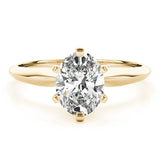 Yellow gold tapered solitaire engagement ring with oval moissanite
