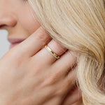 model wearing gold and diamond wedding ring