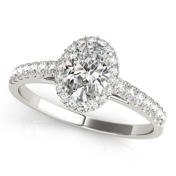 Oval diamond engagement ring with diamond halo and diamonds in the band