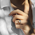 yellow gold oval solitaire engagement ring with oval set east west and a diamond wedding ring