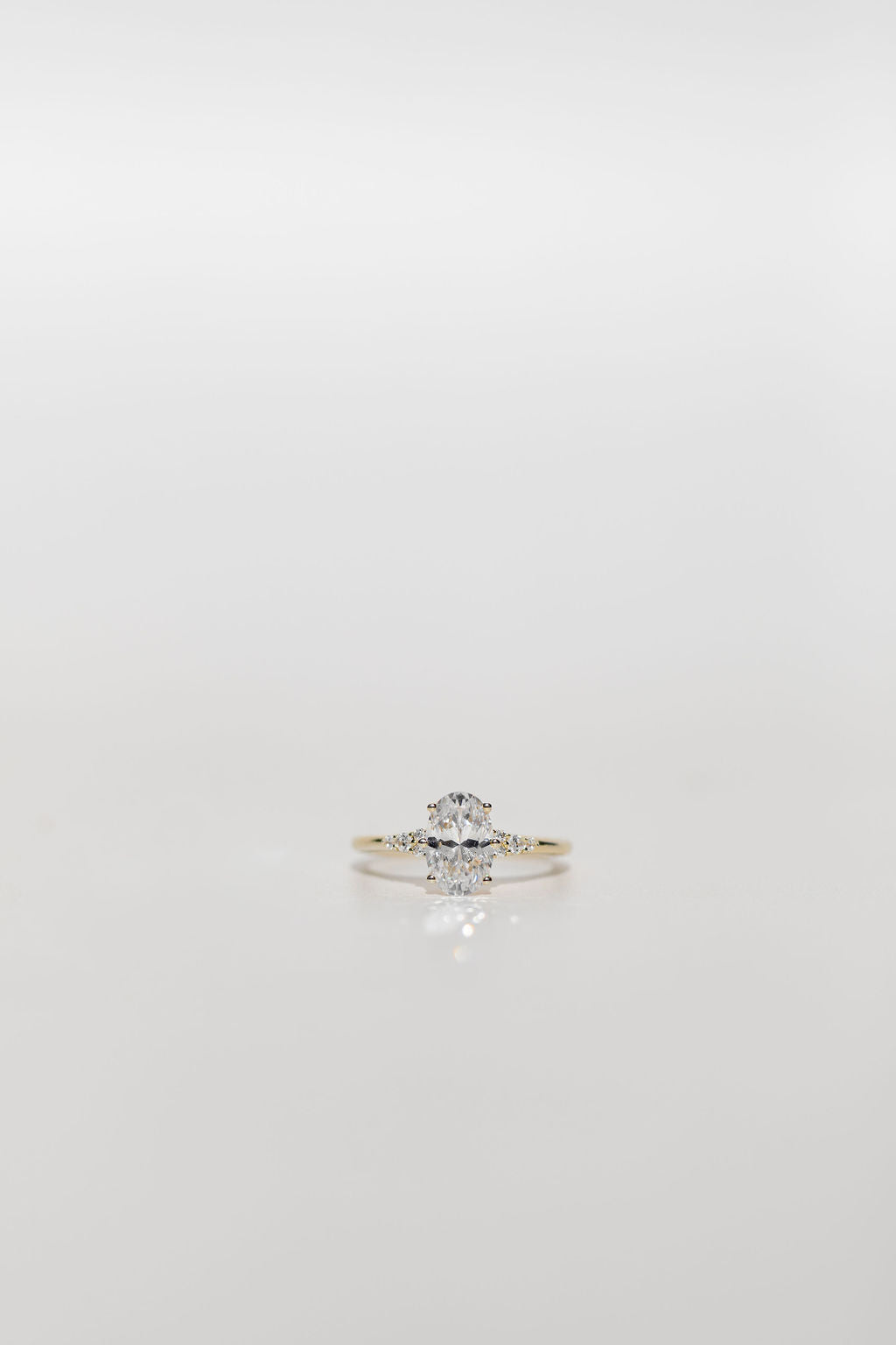 oval cut diamond engagement ring with diamonds on the band