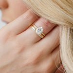 oval solitaire engagement ring with sparkly flat wedding ring