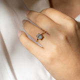 oval solitaire with double claw with gold