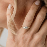 Oval engagement ring with side stones