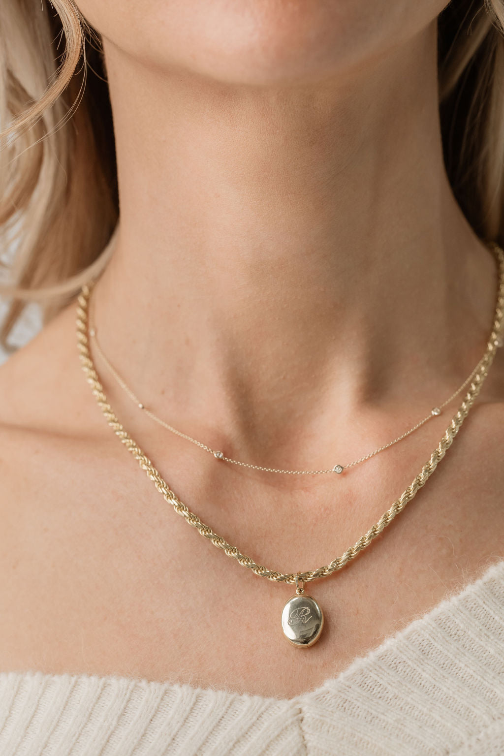 diamond satellite necklace with gold oval locket on rope chain