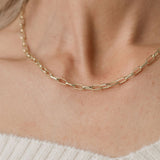 woman wearing paperclip link chain necklace