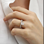 White gold pear shape diamond solitaire engagement ring and white gold diamond wedding ring