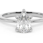 white gold pear moissanite engagement ring