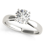 White gold pinched in solitaire with round moissanite